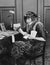 Portrait of woman at desk with letters