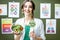 Portrait of a woman dietitian with schemes on the topic of nutrition