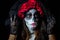 Portrait of woman dressed as catrina, skull to honor the dead in Mexico