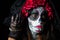 Portrait of woman dressed as catrina, skull to honor the dead in Mexico