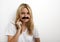 Portrait of woman in fake mustache against white background