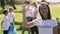 Portrait of woman family recycle plastic bottle activist in white t-shirt, cleaning forest park from junk waste. Spbi