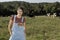 Portrait of a woman farmer with some cows