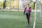 Portrait of woman at the football goal