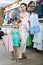 Portrait of woman and girl shopping kids apparel in clothes sto