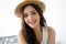 Portrait of a woman in a hat, closeup portrait of a nice female in summer straw hat and looking at camera.Concept woman lifestyle,