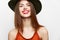 Portrait of a woman in a hat Wide smile charm bare shoulders evening makeup