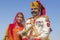 Portrait woman and man wearing traditional Rajasthani dress participate in Mr. Desert contest as part of Desert Festival in Jaisal