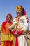 Portrait woman and man wearing traditional Rajasthani dress participate in Mr. Desert contest as part of Desert Festival in Jaisal