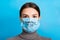 Portrait of a woman in medical mask with stop text at blue background. concept. Respiratory protection