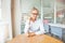 Portrait of woman in office with earphone