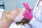 Portrait of woman patient with mask on face waiting time in cosmetology clinic.