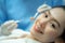 Portrait of woman patient toothy smile while receiving treatment from dentist doctor for oral check up and examining cavities and