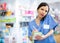 Portrait of woman pharmacist working in drugstore