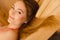Portrait of woman relaxing in sauna. Spa wellbeing
