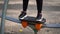 Portrait of woman\'s legs on street simulator in park. Close up of body part of female doing sports on athletic field in