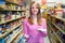 Portrait Of Woman In Supermarket With Shopping List
