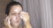 Portrait of woman washing cleaning face using organic foamy soap in bathroom.