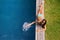 Portrait of woman, water or tan at swimming pool to relax or chill in summer holiday vacation in Hawaii. Smile, break or