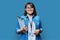 Portrait of woman worker with industrial center card clipboard, on blue background