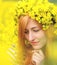 Portrait of a woman with wreath of yellow flowers on the head.