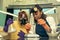 Portrait of women preparing drugs using scales in laboratory