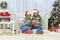 Portrait of women in Santa hat celebrating Christmas