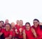 Portrait Of Womens Football Team Celebrating Winning Soccer Match On Outdoor Astro Turf Pitch