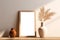 Portrait wooden frame mockup basks in sunlight, paired with organic vase