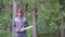 Portrait of worker in a helmet with a chainsaw in the forest