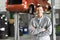 Portrait worker/mechanic in a garage - smiling man in workwear