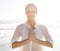 Portrait, yoga and meditation with woman on beach at sunset for wellness, balance or inner peace. Summer, nature and zen