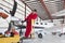 Portrait of young aeronautic engineer standing in front of an airplane propeller