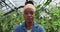 Portrait of young african american woman looking to camera . Close up view of female farmer in casual clothes posing