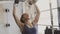 Portrait of young african athlete doing dumbbell exercises in modern gym.