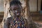 Portrait of a young African girl wearing a colorful dress in the town of Nhacra in Guinea Bissau