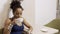 Portrait of young Afro American woman who is drinking coffee in the cafe