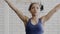 Portrait of young afroamerican lady who is doing warm up exercises in the gym before training.