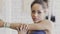 Portrait of young afroamerican woman, who is stretching her shoulder muscules in the gym.