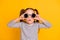 Portrait of young amazed surprised impressed little girl kid child wear funky round sunglasses  on yellow color