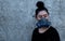Portrait young Asia woman putting on a half mask replaceable particulate filter respirator at concrete wall background with copy
