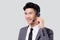 Portrait young asian business man call center wearing headset isolated on white background.