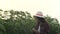 Portrait of young asian farmer smiling in cassava fields