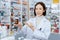 Portrait of young asian pharmacist pill bottle mockup at qualified pharmacy