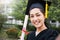 Portrait of young asian woman outside on her graduated day