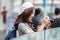 Portrait of young Asian woman tourist with digital camera in hands. Travel and vacation concept