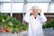 Portrait young asian woman wearing glasses cultivation strawberry with happiness for farm greenhouse laboratory.