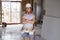 Portrait of young attractive builder man on his 20s posing happy confident and proud at construction site wearing protection helme