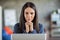 Portrait of young attractive serious focused thoughtful minded businesswoman thinking look in laptop work at office