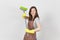 Portrait of young attractive smiling brunette caucasian housewife on white background. Beautiful housekeeper woman